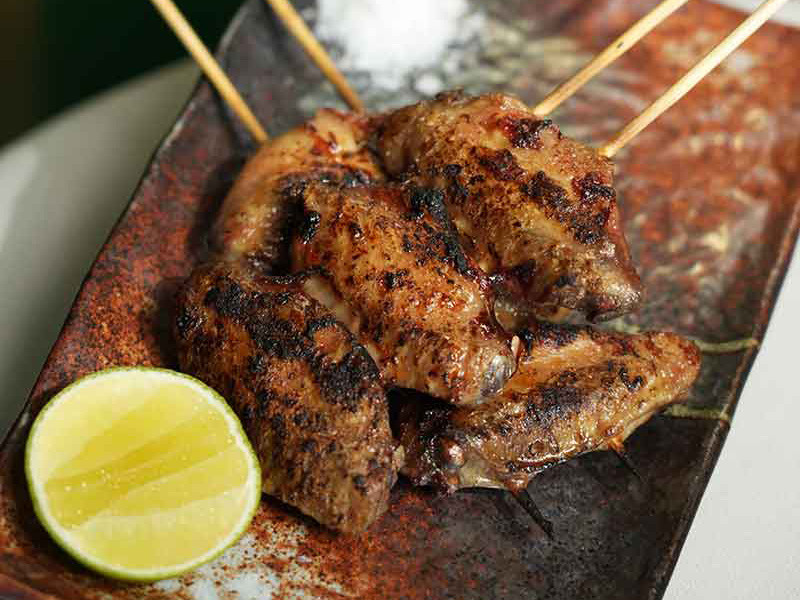 KAYA Bahrain Food Menu MARINATED CHICKEN WINGS SKEWER